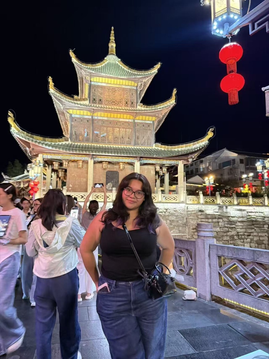 An au pair exploring China while travelling with her host family